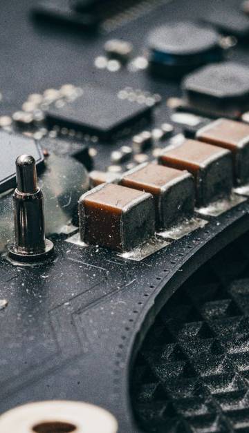 Detailed macro shot of an electronic circuit board showcasing various components.