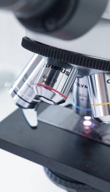 Detailed view of a microscope in a laboratory used in scientific research.